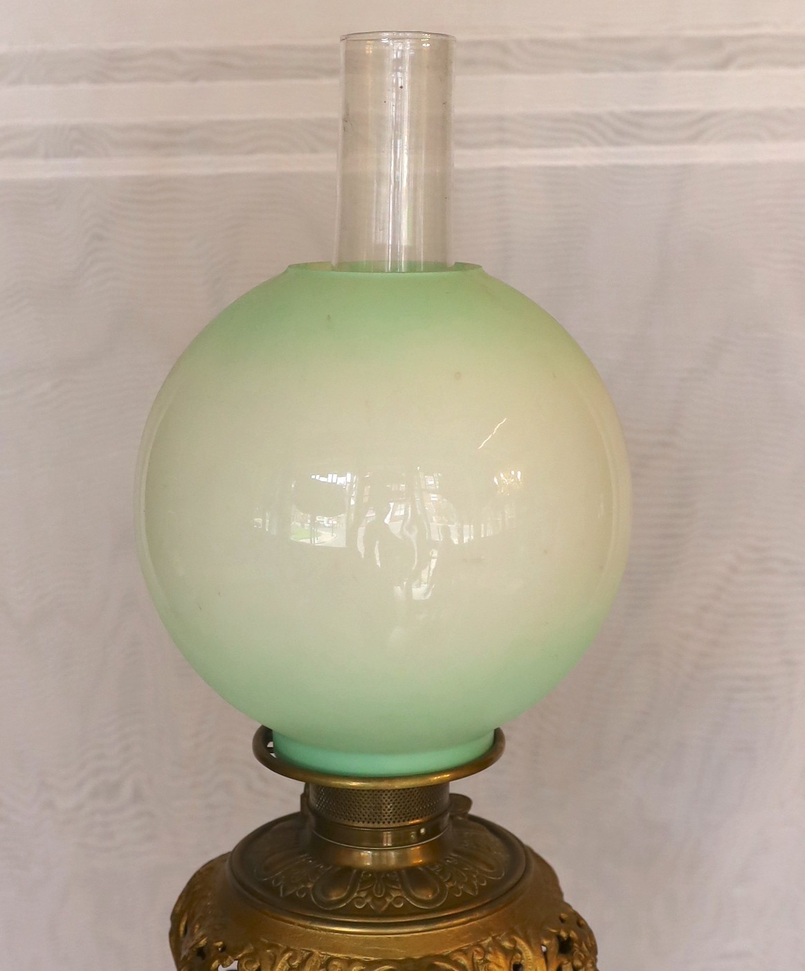 A late 19th century English pierced brass green onyx and glass lamp standard etagere, height overall 154cm, width 48cm